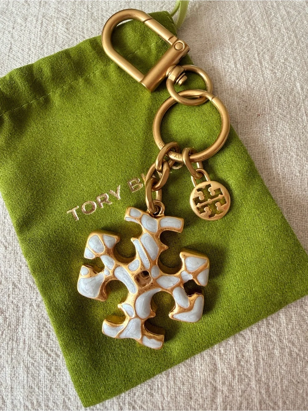 Tory Burch Gold-Tone Key / Bag Charm with White Enamel Logo